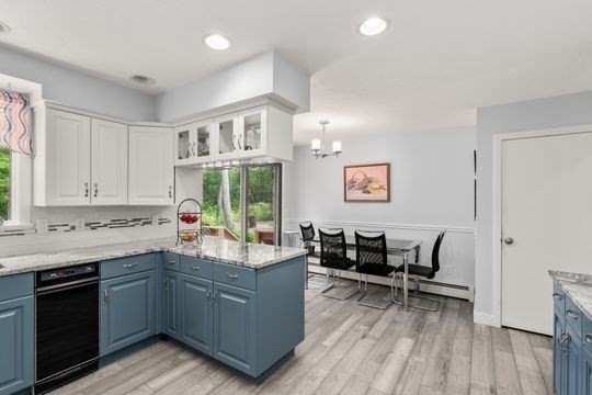 170 Millville Road Mendon, MA 01756 - Photo 13 of 33 a kitchen with a cabinets and chairs