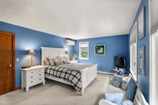170 Millville Road Mendon, MA 01756 - Photo 14 of 33 a bedroom with a bed and a flat screen tv
