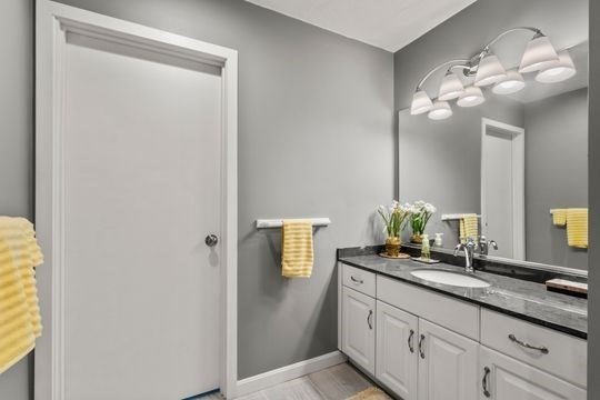 170 Millville Road Mendon, MA 01756 - Photo 17 of 33 a bathroom with a double vanity sink and a mirror
