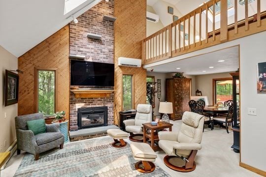 170 Millville Road Mendon, MA 01756 - Photo 4 of 33 a living room with furniture a fireplace and a flat screen tv