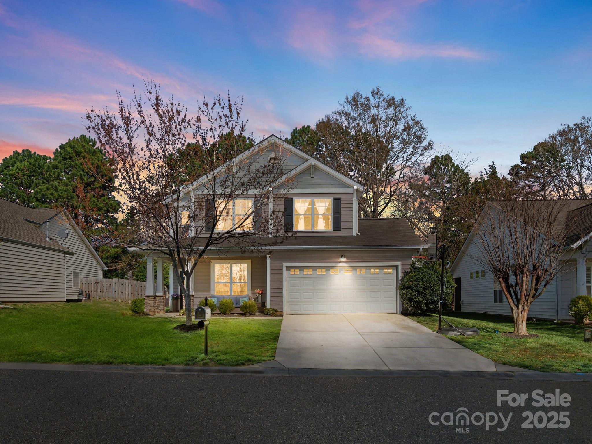 421 Silver Cypress Lane Fort Mill, SC 29708 - Photo 1 of 37 a front view of a house with a yard and garage