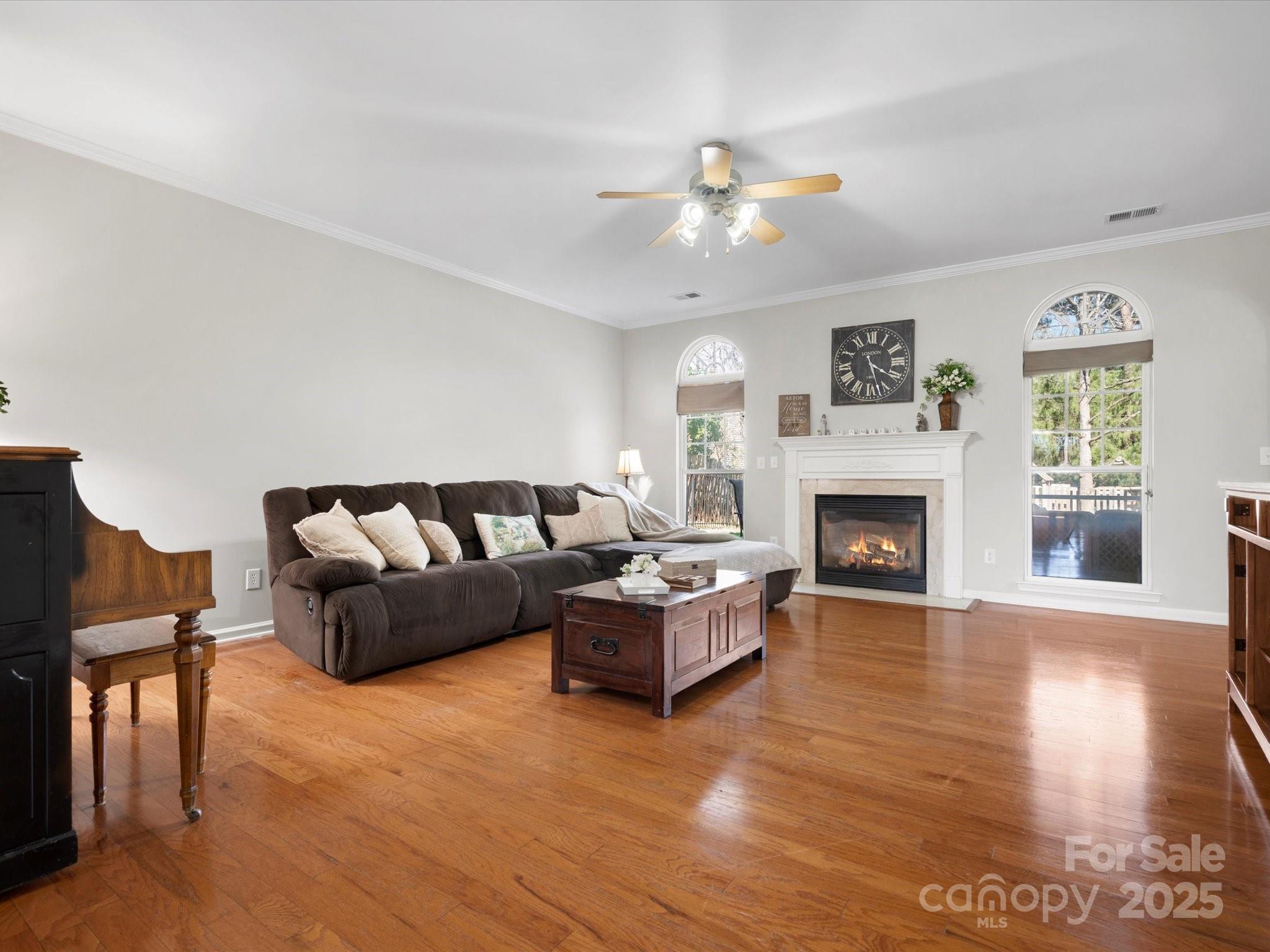 421 Silver Cypress Lane Fort Mill, SC 29708 - Photo 11 of 37 a living room with furniture and a fireplace