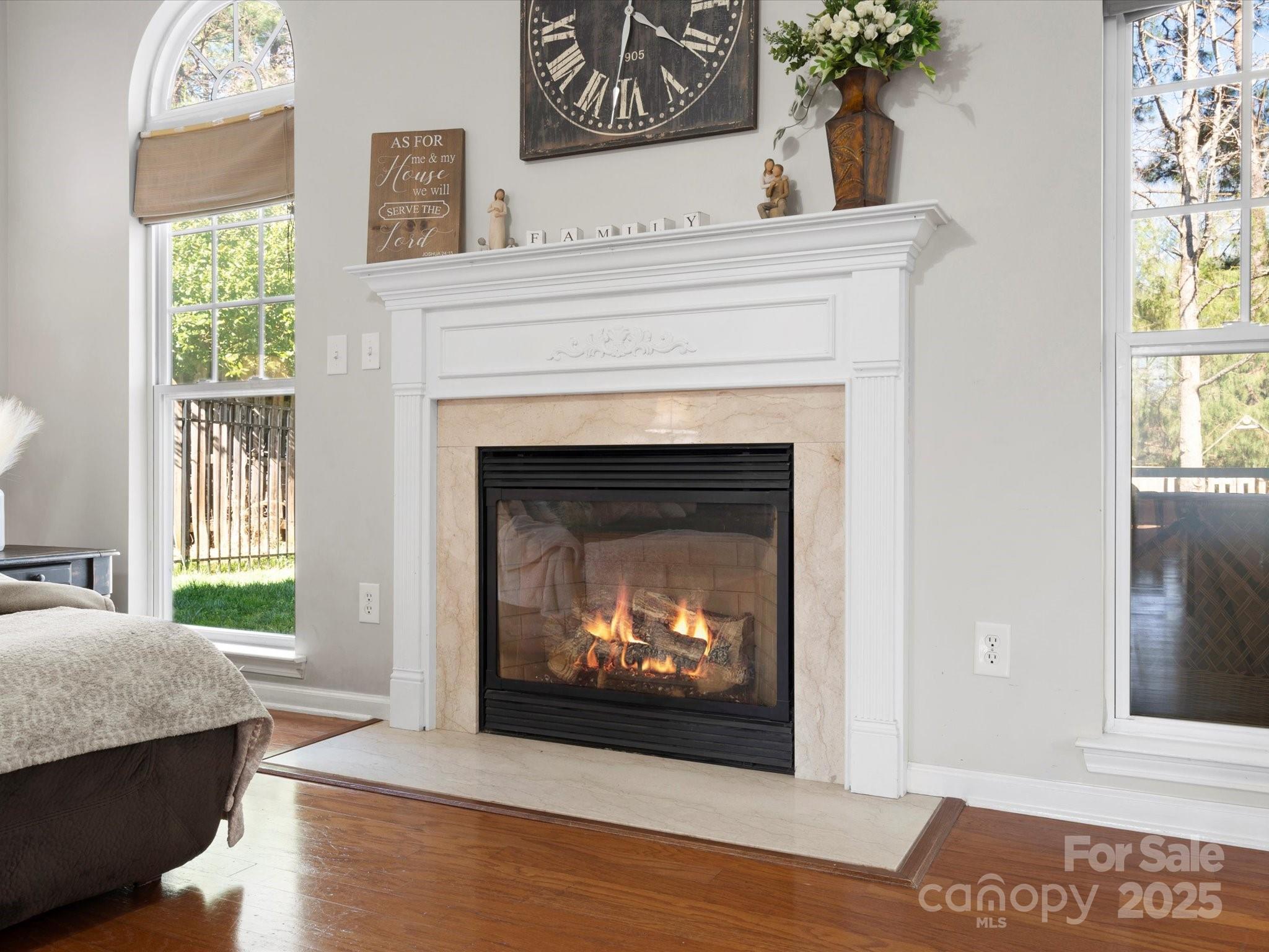 421 Silver Cypress Lane Fort Mill, SC 29708 - Photo 13 of 37 a living room with a fireplace and a table