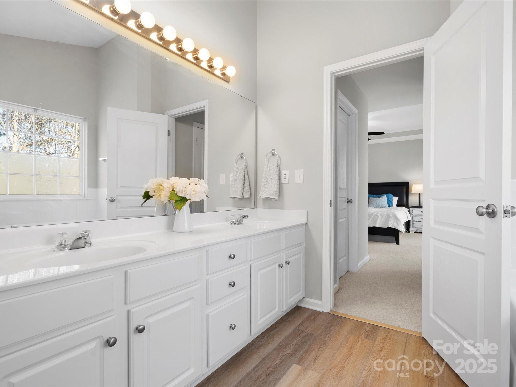 421 Silver Cypress Lane Fort Mill, SC 29708 - Photo 27 of 37 a en suite bathroom with a double vanity sink and a mirror