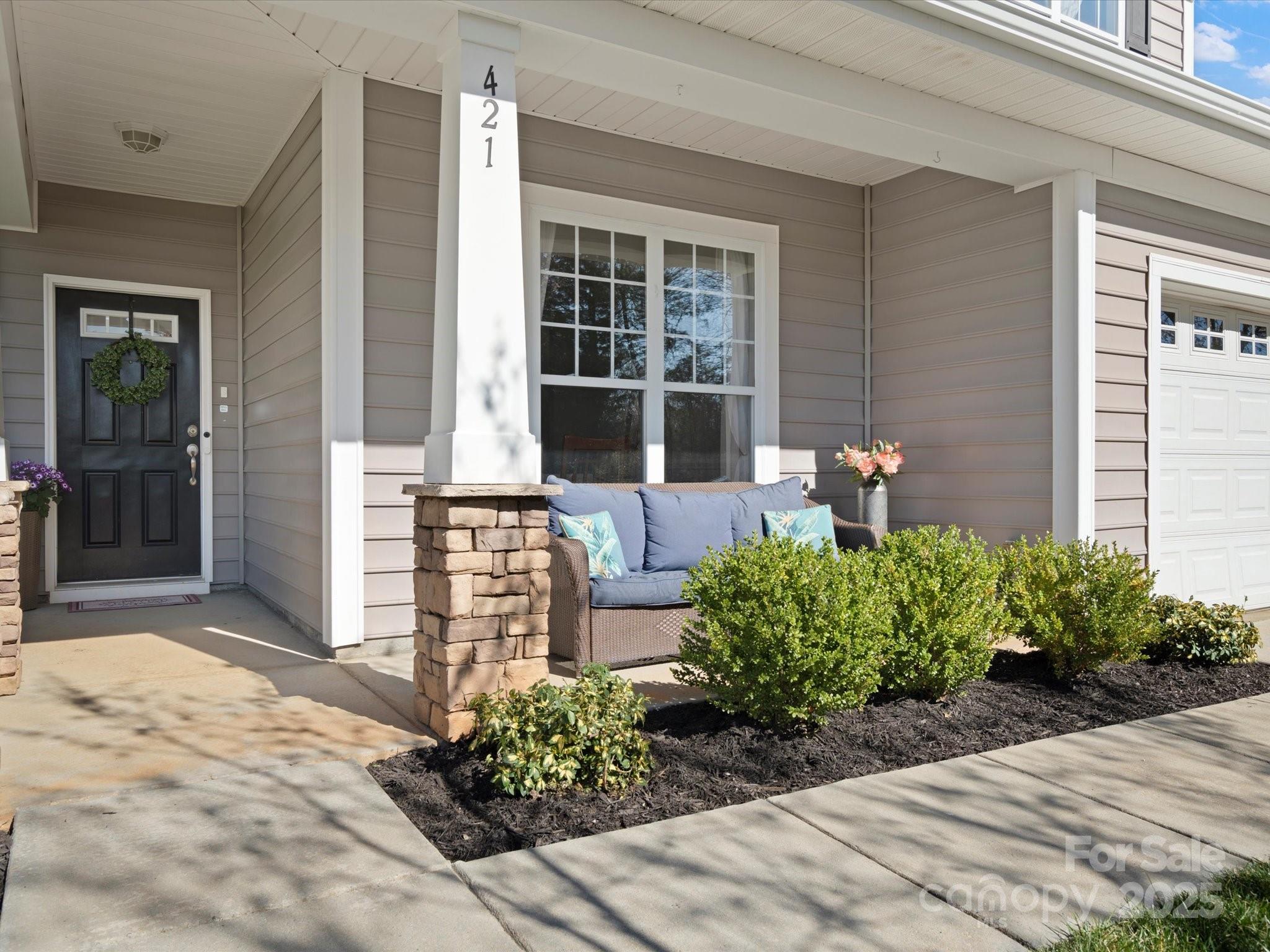 421 Silver Cypress Lane Fort Mill, SC 29708 - Photo 5 of 37 a front view of a house with garden