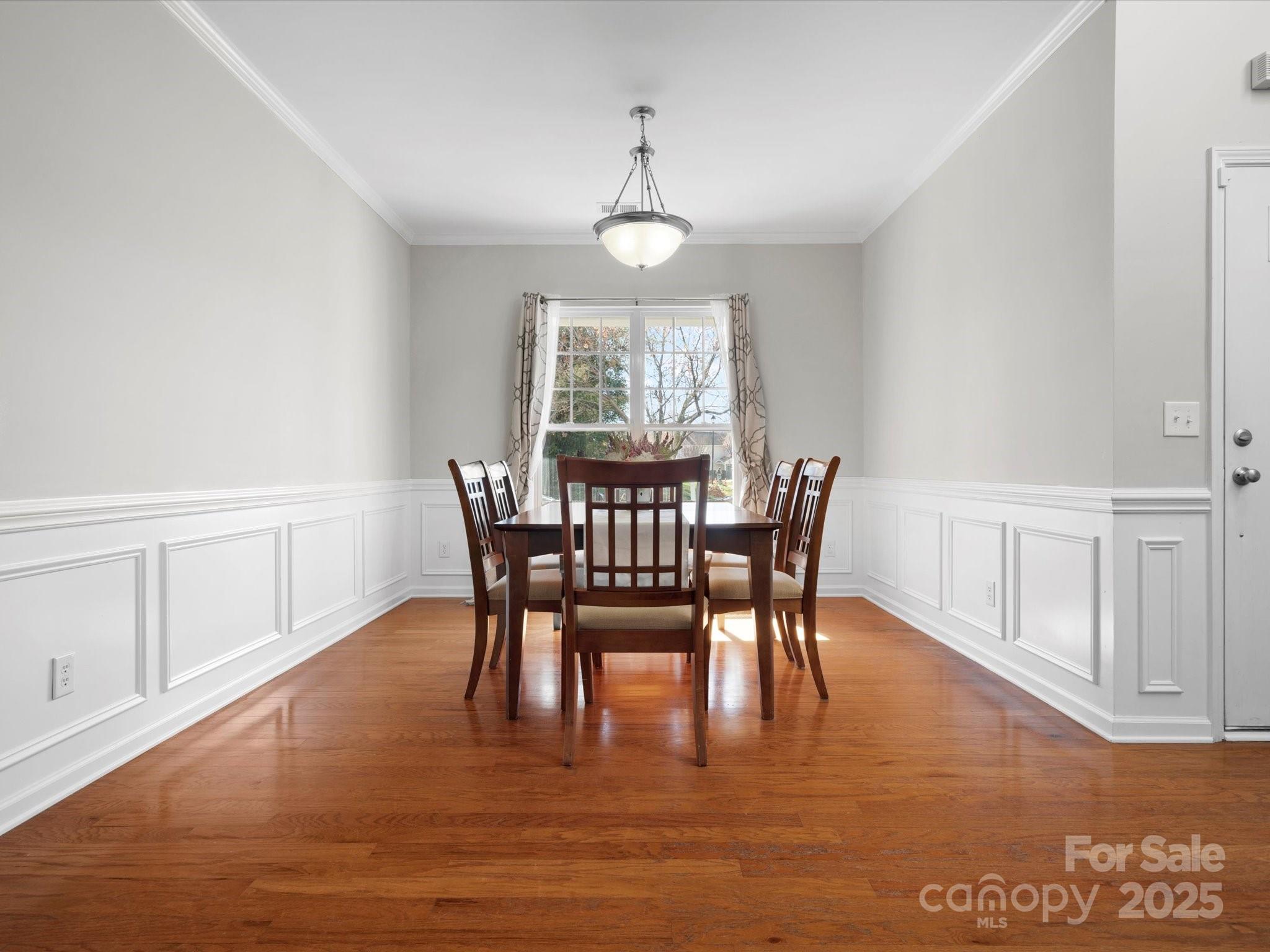 421 Silver Cypress Lane Fort Mill, SC 29708 - Photo 8 of 37 a view of a dining room with furniture window and wooden floor