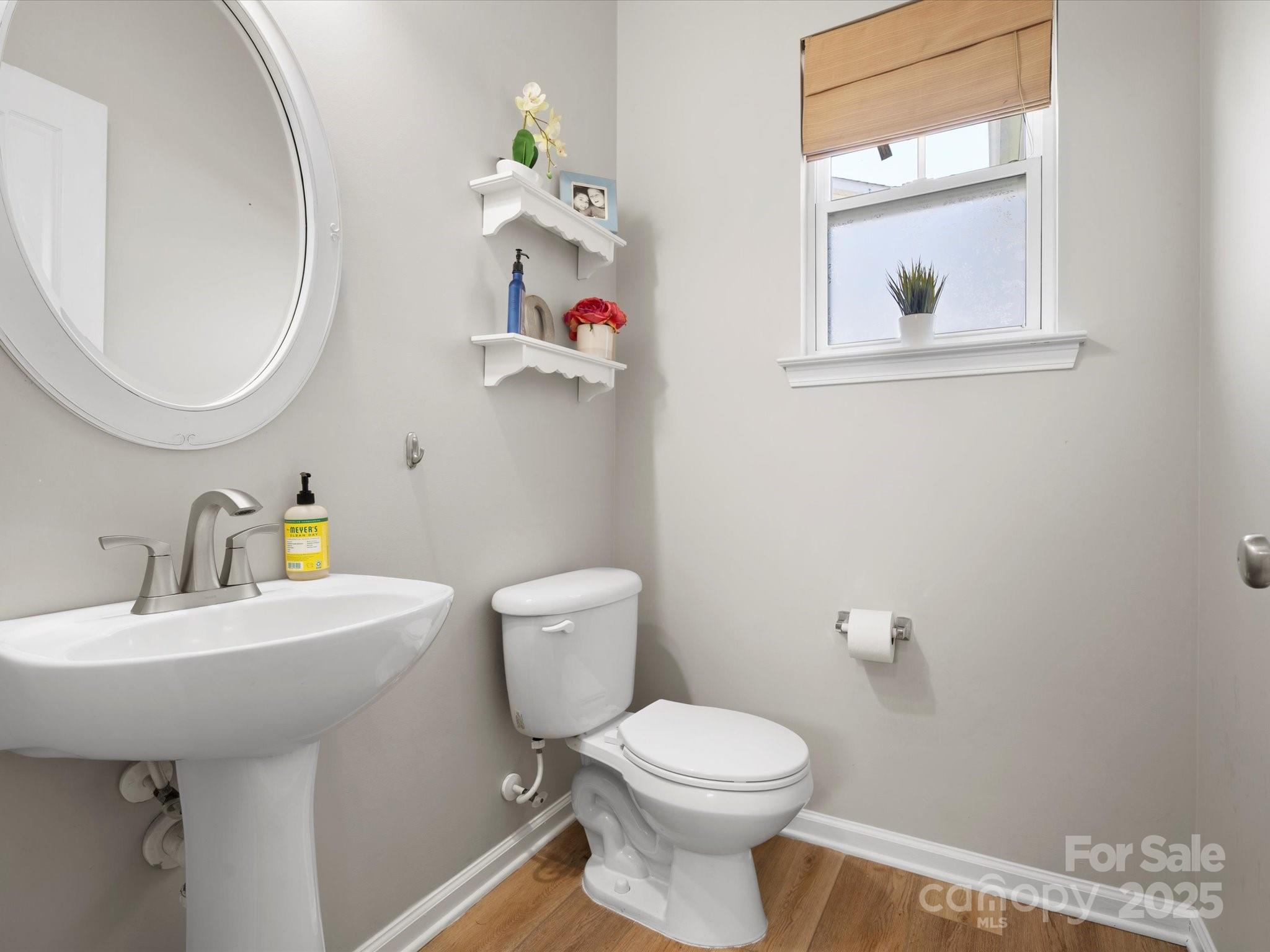 421 Silver Cypress Lane Fort Mill, SC 29708 - Photo 9 of 37 a bathroom with a toilet sink and mirror