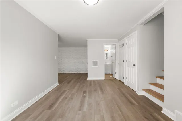 a view of wooden floor in an empty room