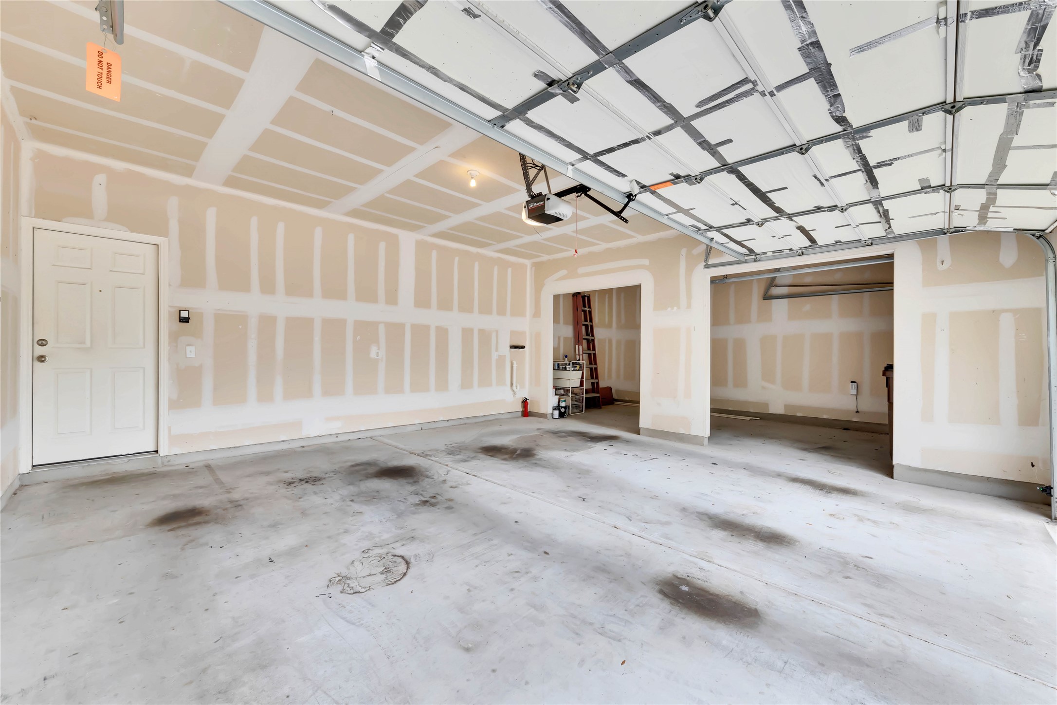 2133 Paradise Ridge Drive Round Rock, TX 78665 - Photo 20 of 22 Spacious garage with concrete flooring, automatic garage door opener, and multiple unfinished wall sections