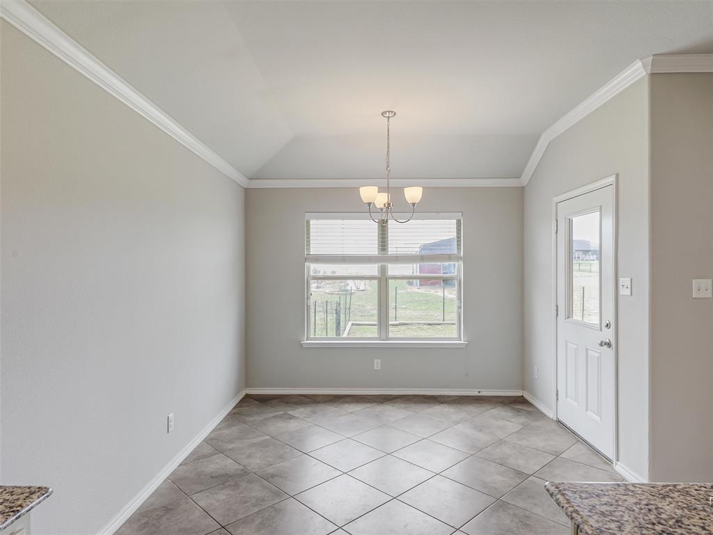 132 County Road 4213 Decatur, TX 76234 - Photo 7 of 27 a view of an empty room with a window