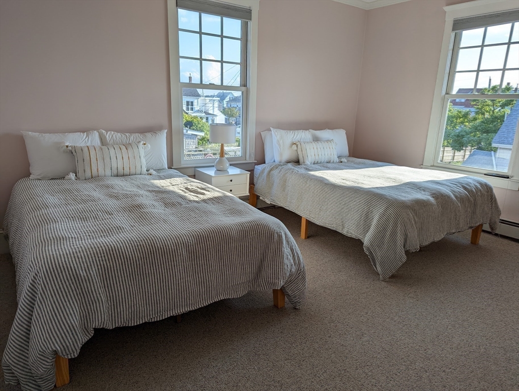 351 Beach Avenue Hull, MA 02045 - Photo 16 of 24 a bedroom with two beds and windows