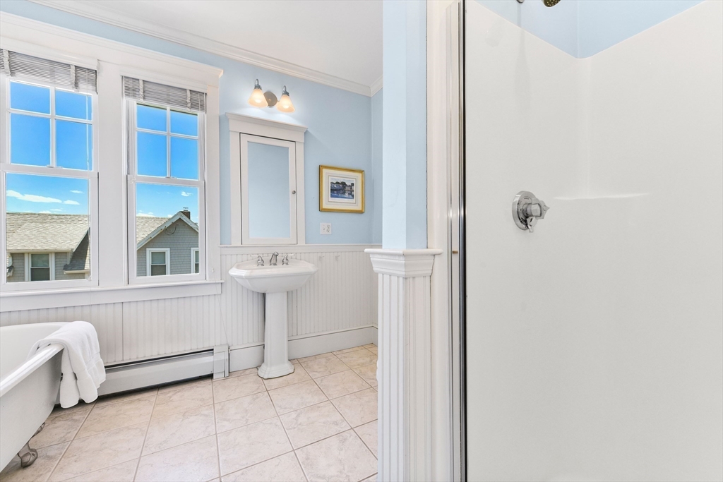 351 Beach Avenue Hull, MA 02045 - Photo 17 of 24 a bathroom with a sink and a mirror