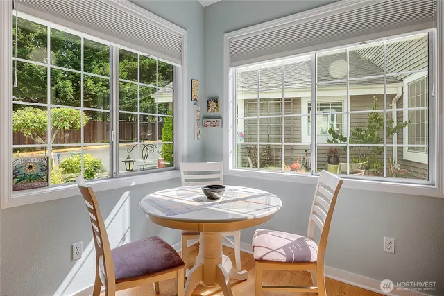 a dining room with furniture and windows