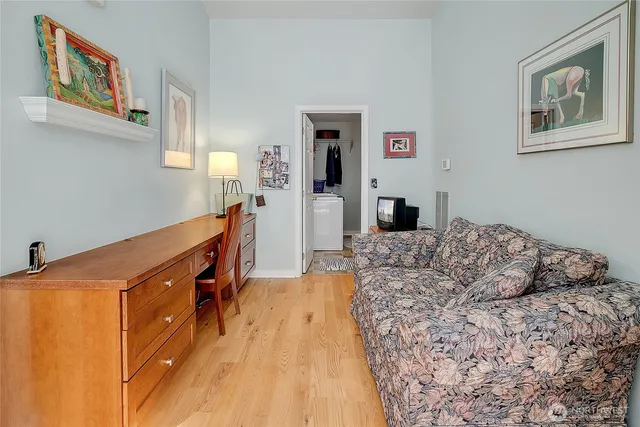 a bedroom with a bed and a cabinets