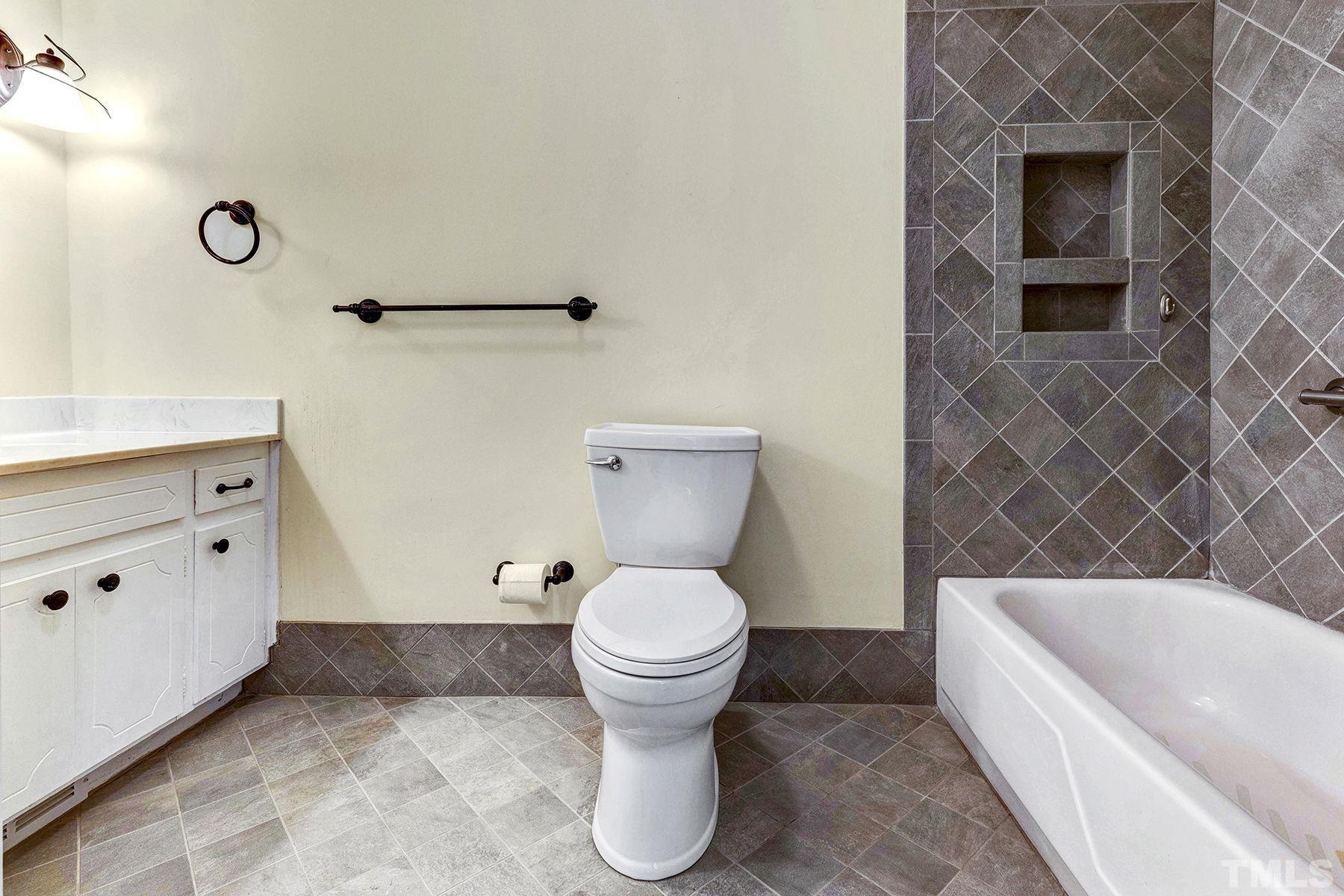 5505 Knollwood Road Raleigh, NC 27609 - Photo 13 of 33 a bathroom with a toilet and a sink