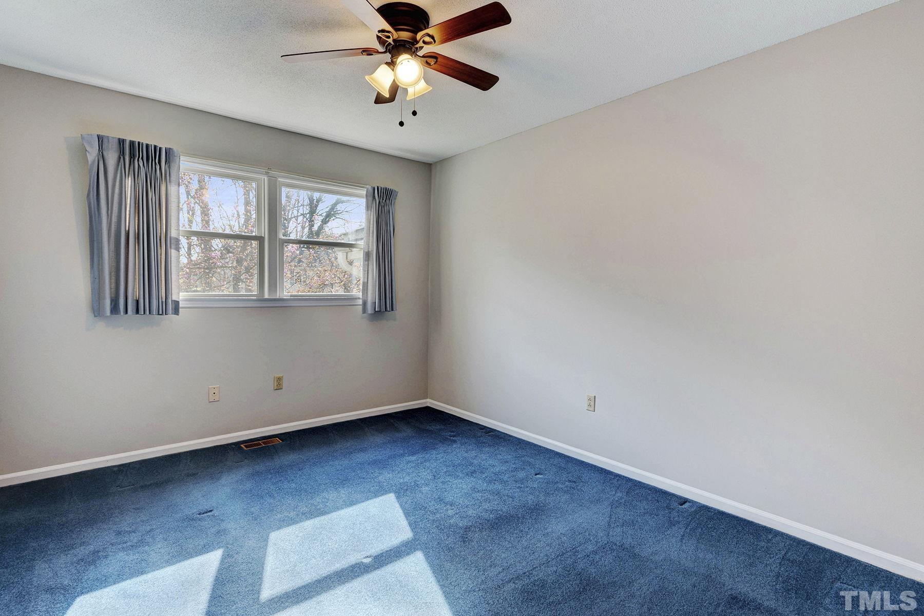 5505 Knollwood Road Raleigh, NC 27609 - Photo 16 of 33 an empty room with windows and fan
