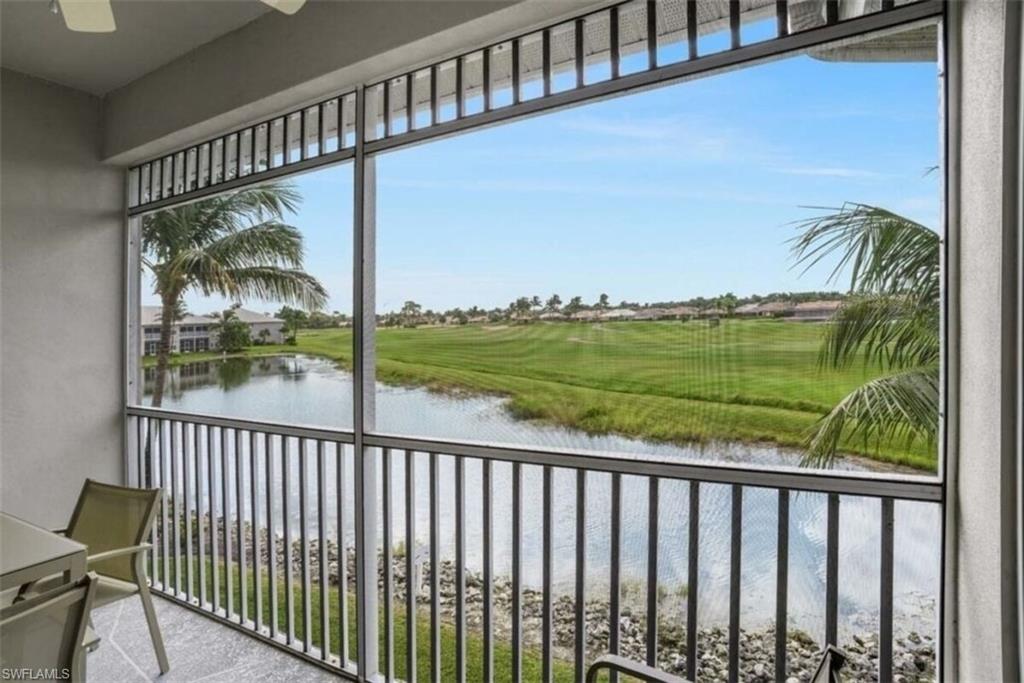 7935 Mahogany Run Lane, Unit 726 Naples, FL 34113 - Photo 15 of 24 Balcony featuring a water view and a sunroom