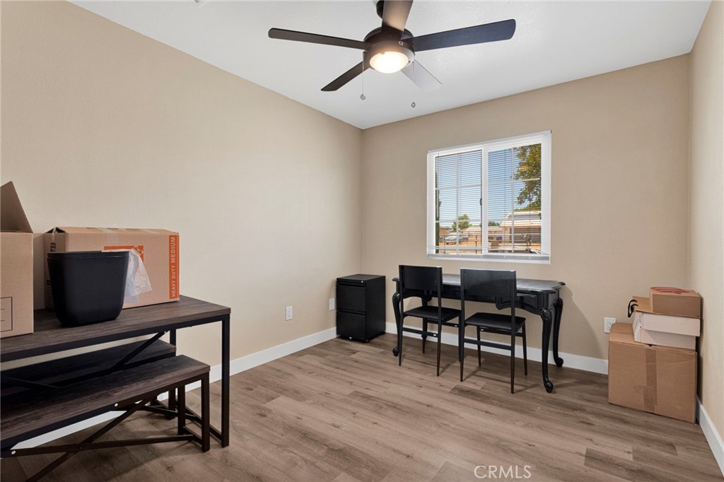 15471 Washoan Road Apple Valley, CA 92307 - Photo 19 of 38 a workspace with furniture and wooden floor
