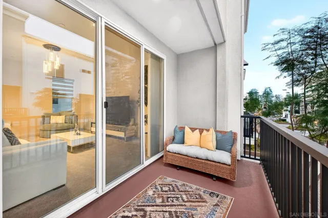 a balcony with view of outdoor space