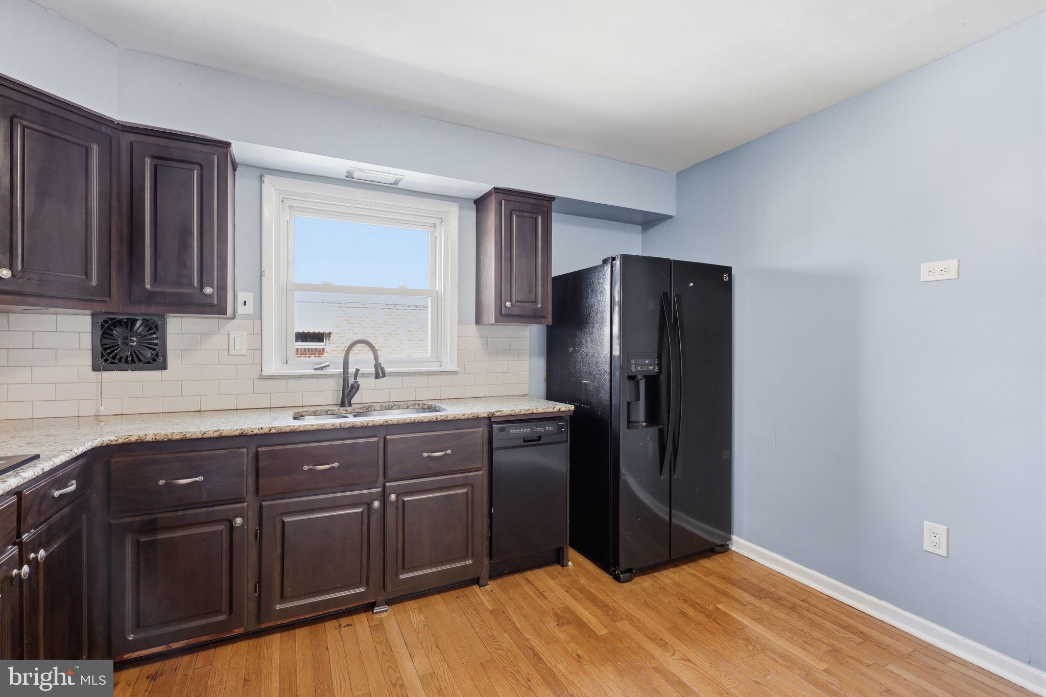 3908 Pearson Avenue Philadelphia, PA 19114 - Photo 13 of 30 a kitchen with stainless steel appliances granite countertop a refrigerator and a sink