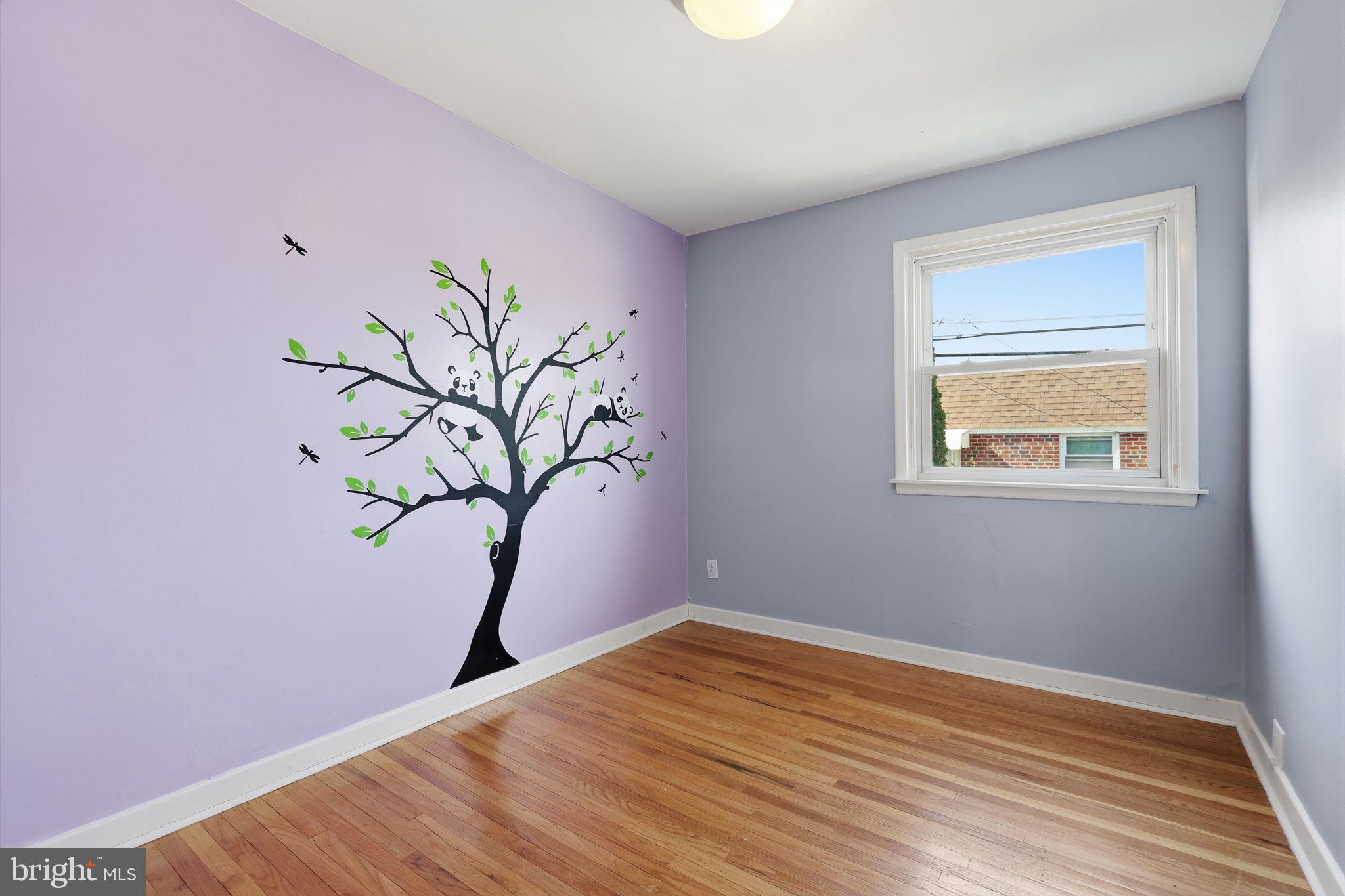 3908 Pearson Avenue Philadelphia, PA 19114 - Photo 18 of 30 a view of a room with wooden floor and a potted plant
