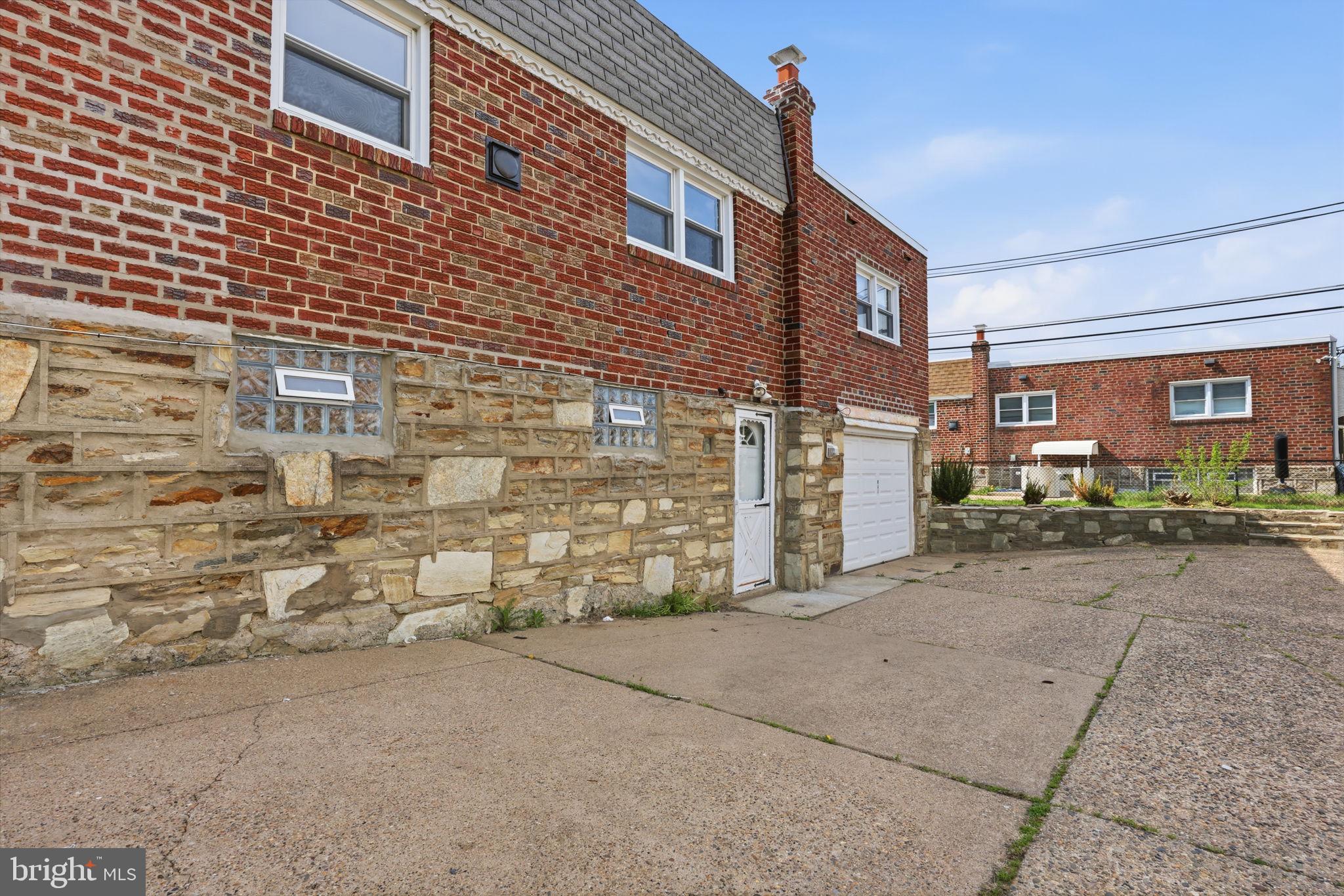 3908 Pearson Avenue Philadelphia, PA 19114 - Photo 28 of 30 a view of a brick building with many windows