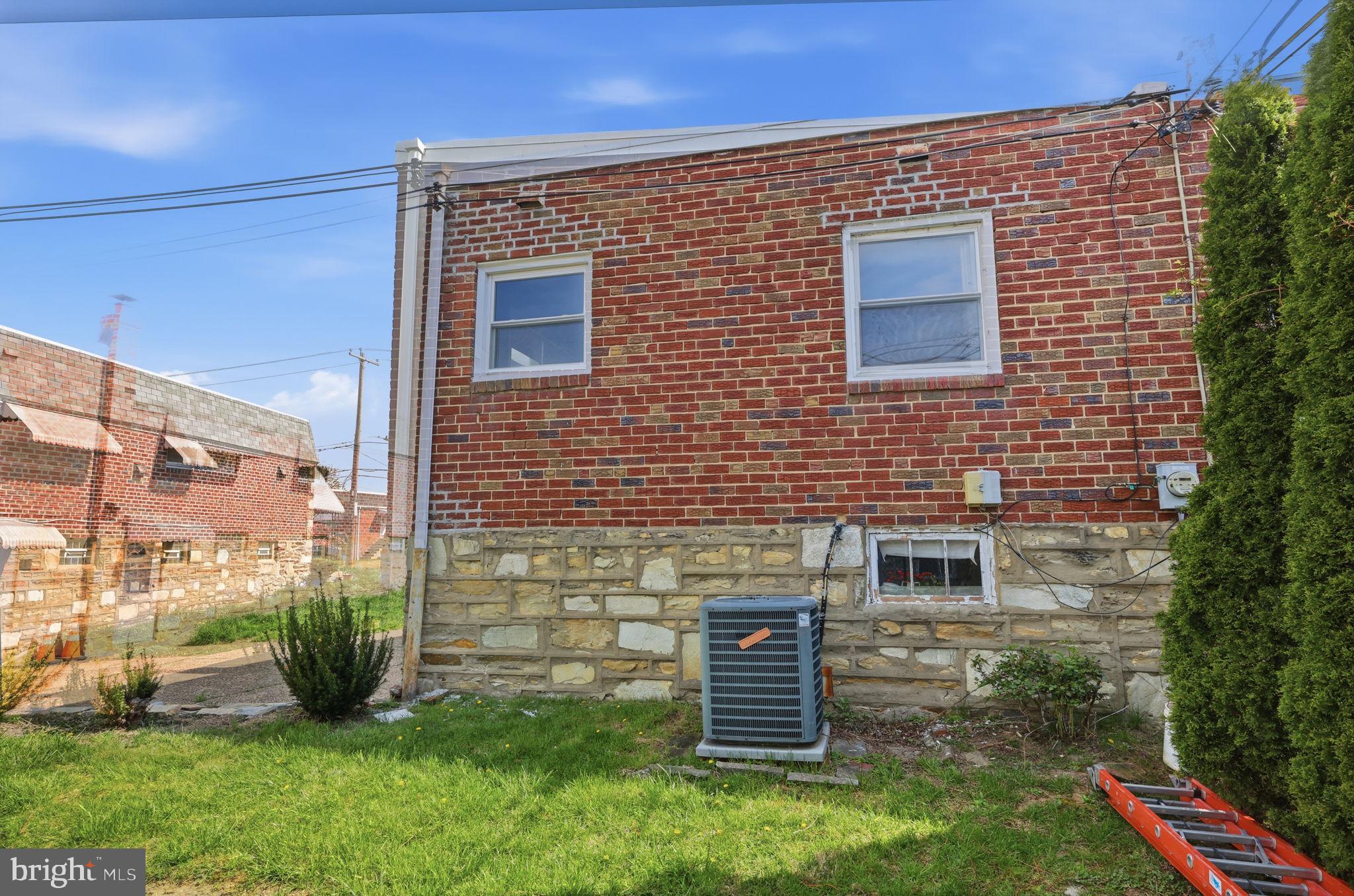 3908 Pearson Avenue Philadelphia, PA 19114 - Photo 30 of 30 a brick building with a yard