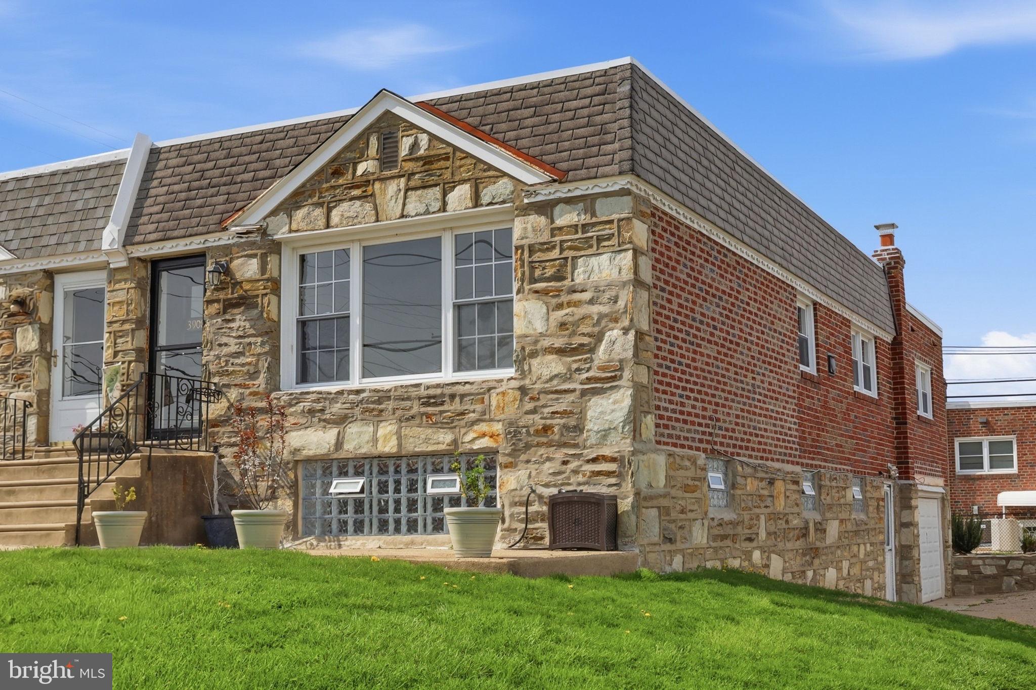 3908 Pearson Avenue Philadelphia, PA 19114 - Photo 4 of 30 a front view of a house with a garden
