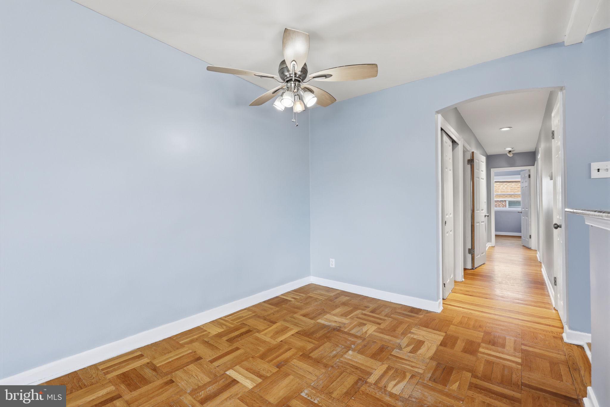 3908 Pearson Avenue Philadelphia, PA 19114 - Photo 8 of 30 a view of a room with wooden floor and ceiling fan