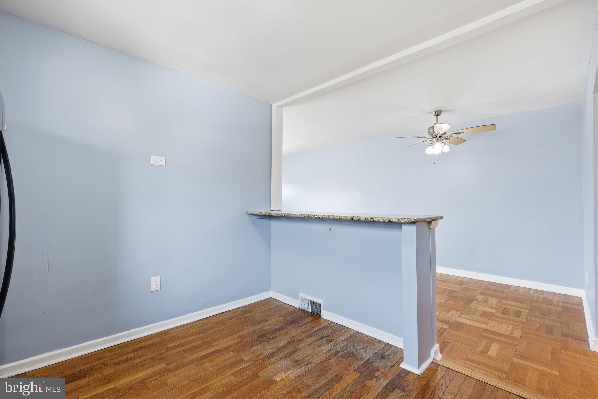 3908 Pearson Avenue Philadelphia, PA 19114 - Photo 10 of 30 a view of a room with wooden floor and a ceiling fan
