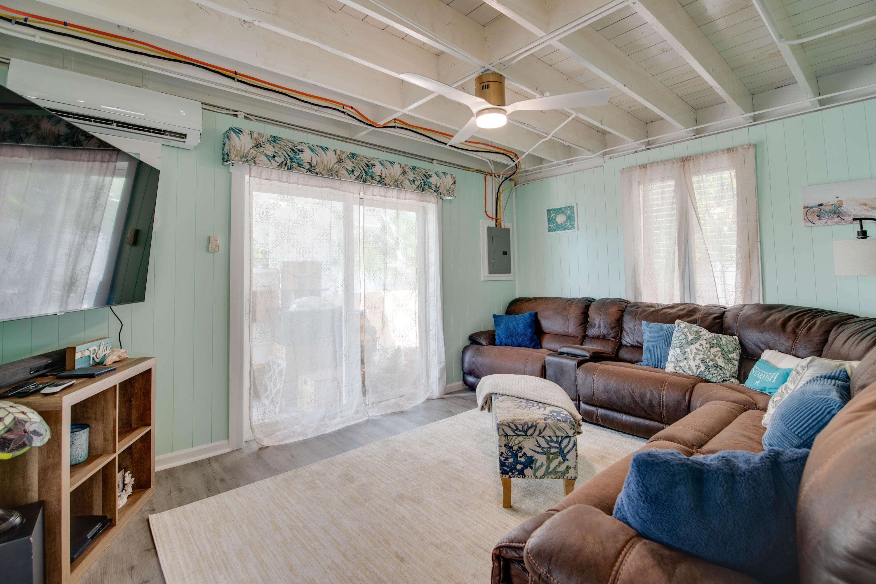 31541 Ave A Big Pine Key, FL 33043 - Photo 12 of 35 a living room with furniture a flat screen tv and a window