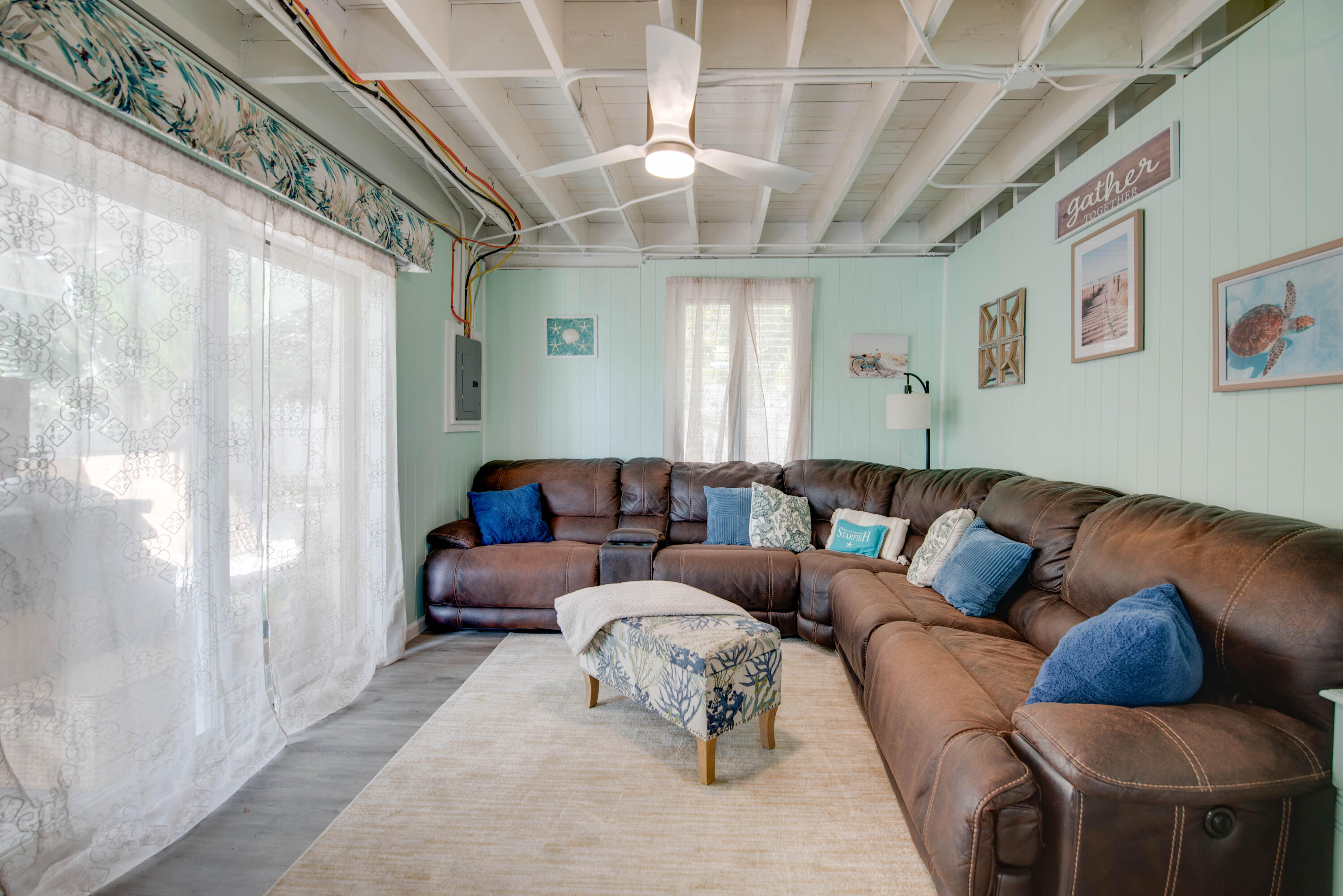 31541 Ave A Big Pine Key, FL 33043 - Photo 13 of 35 a living room with furniture and a chandelier