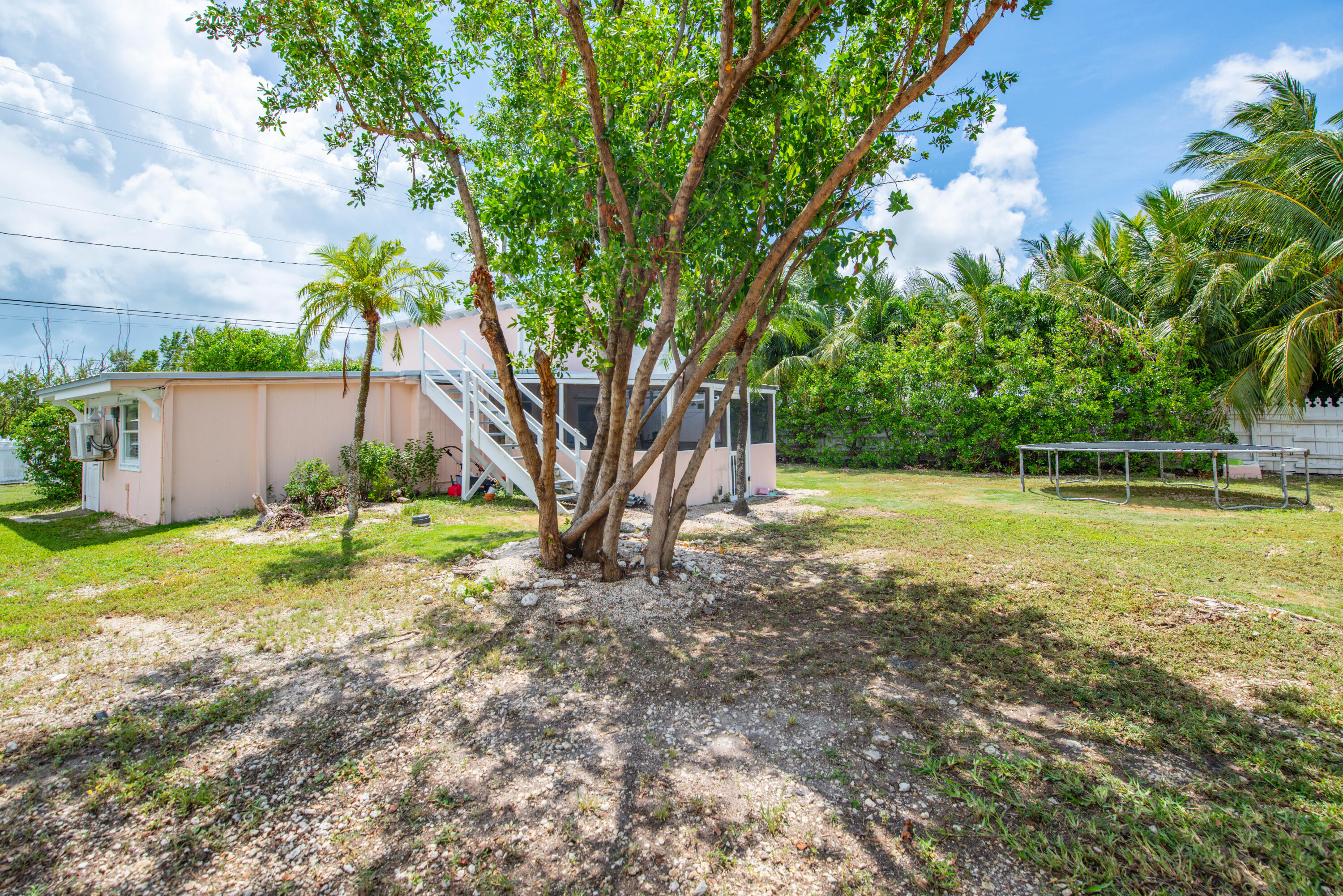 31541 Ave A Big Pine Key, FL 33043 - Photo 25 of 35 a view of a backyard with large trees