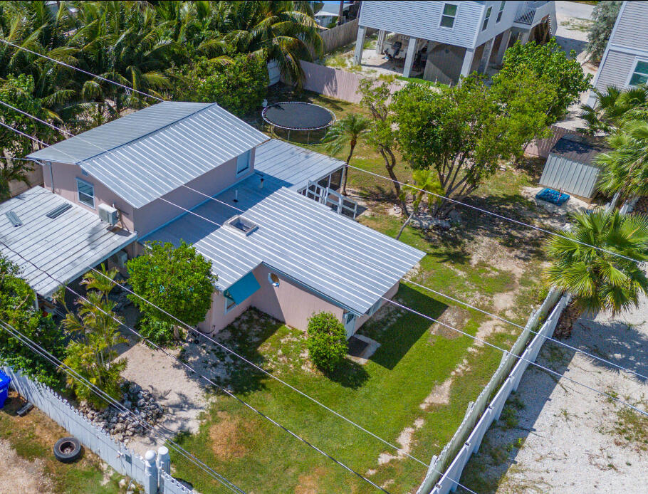 31541 Ave A Big Pine Key, FL 33043 - Photo 27 of 35 an aerial view of a house with a garden
