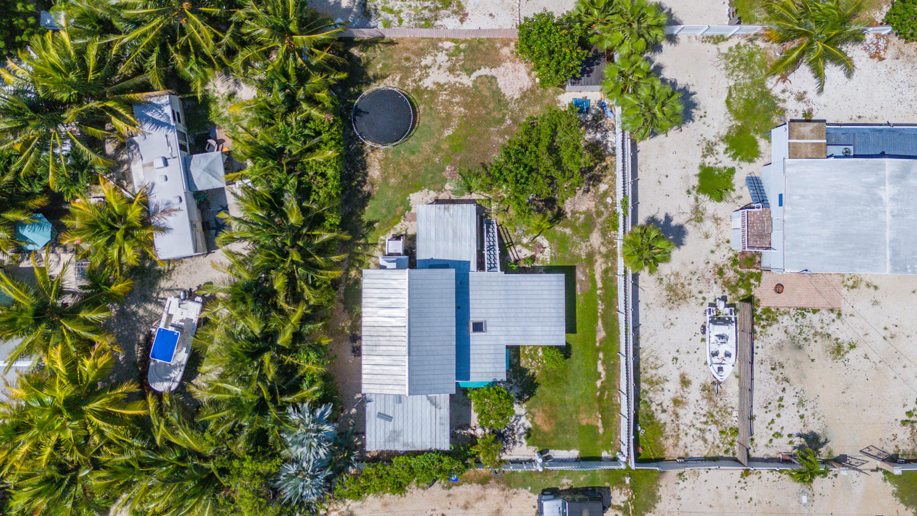 31541 Ave A Big Pine Key, FL 33043 - Photo 29 of 35 an aerial view of a house with a yard and garden