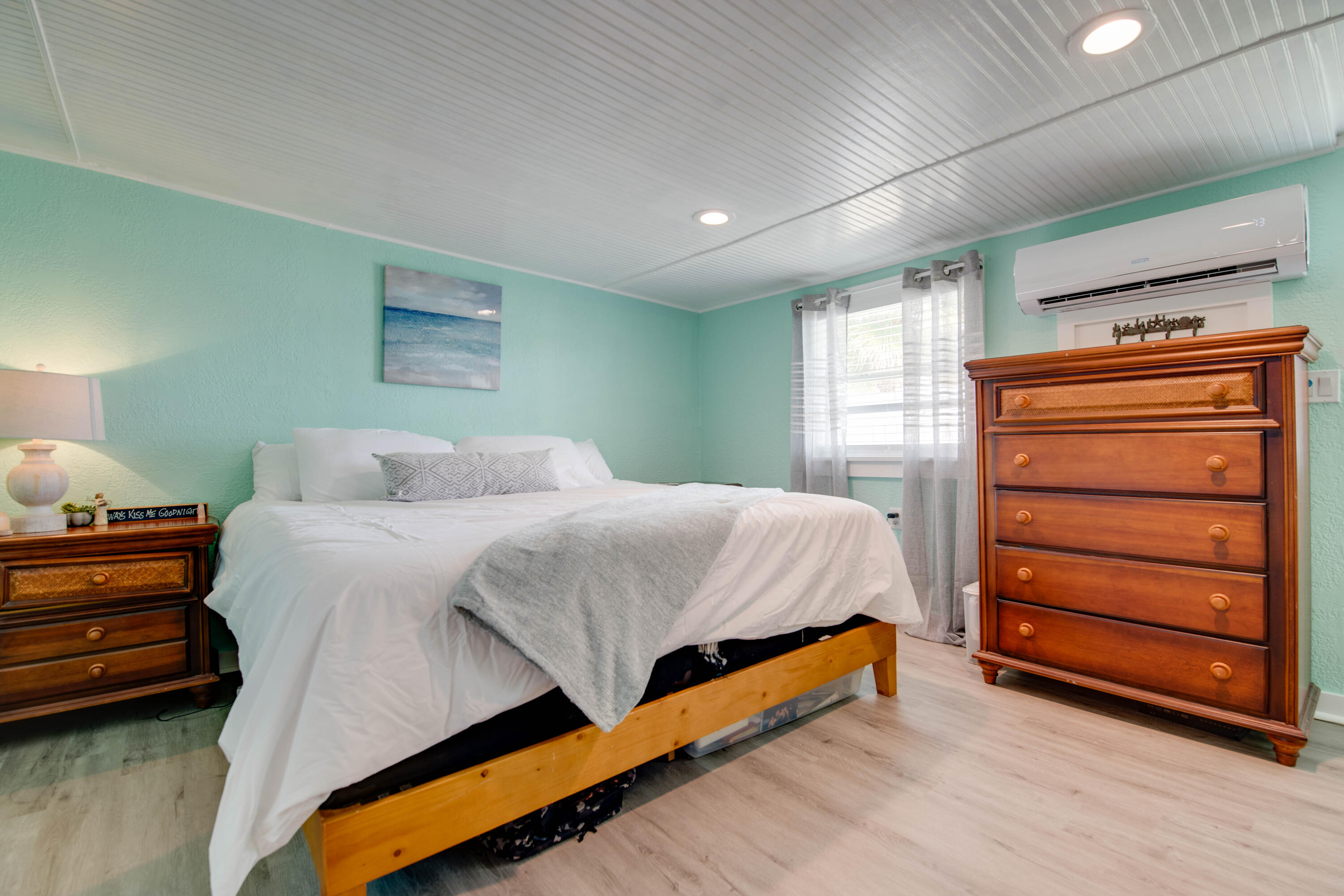 31541 Ave A Big Pine Key, FL 33043 - Photo 7 of 35 a bedroom with a bed and a dresser