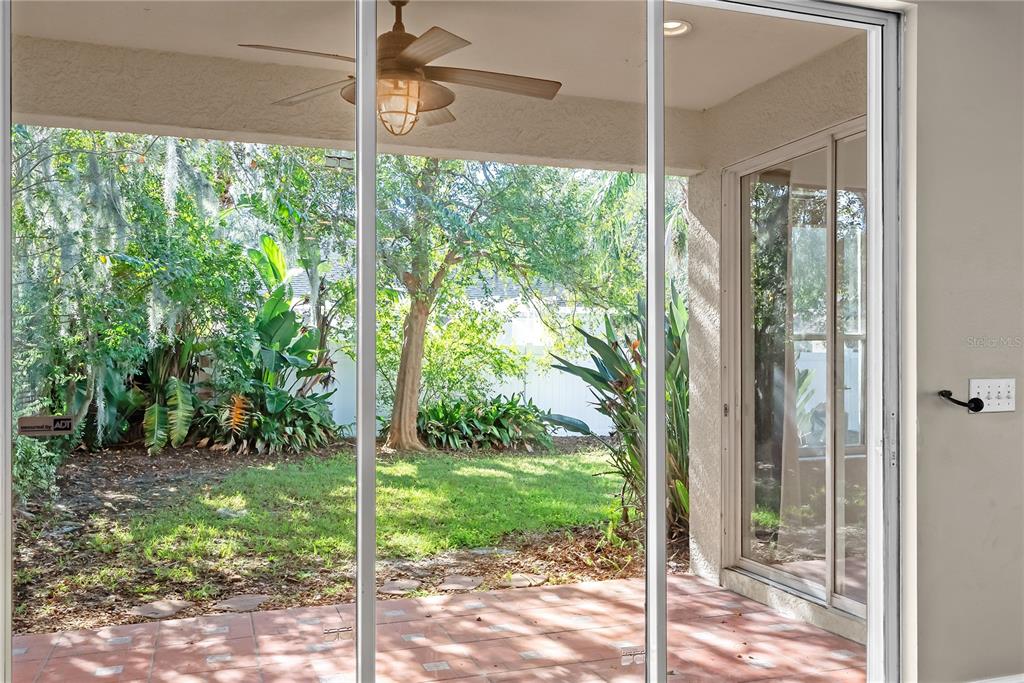 5012 Mirror Ridge Court Lutz, FL 33558 - Photo 15 of 44 a view of a glass door and a yard