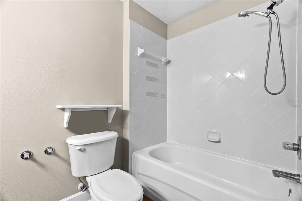 5012 Mirror Ridge Court Lutz, FL 33558 - Photo 30 of 44 a white toilet sitting next to a bath tub