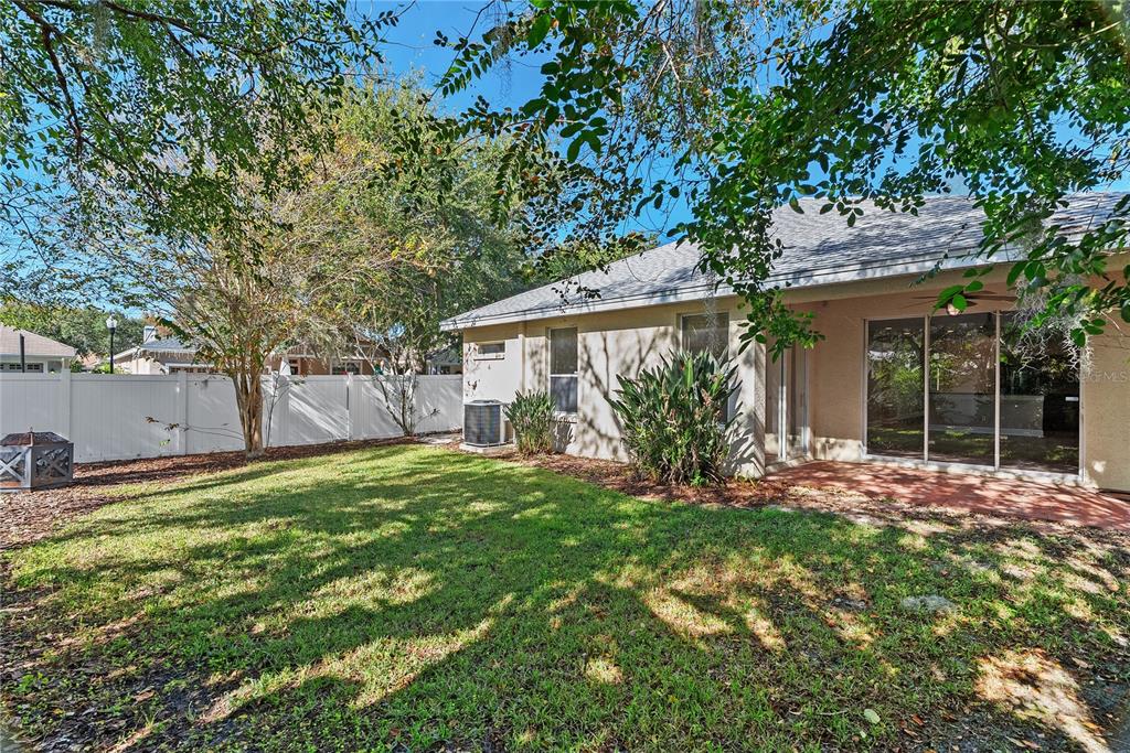 5012 Mirror Ridge Court Lutz, FL 33558 - Photo 41 of 44 front view of a house with a yard