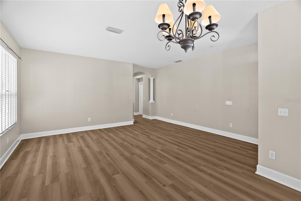 5012 Mirror Ridge Court Lutz, FL 33558 - Photo 6 of 44 a view of a livingroom with wooden floor