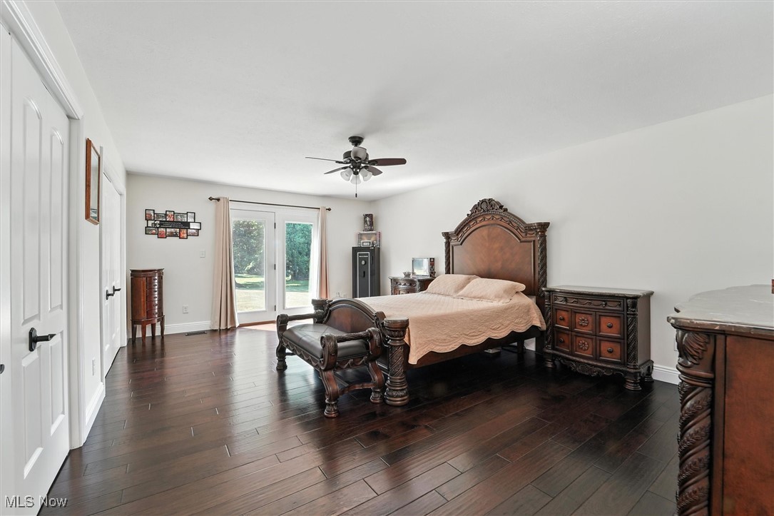 2930 South Ridge Road East Kingsville, OH 44048 - Photo 27 of 49 Bedroom featuring wood finished floors, access to outside, a ceiling fan, and french doors