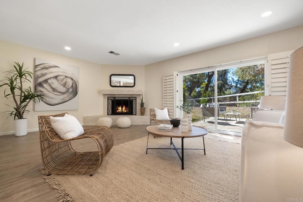 3163 Via De Caballo Encinitas, CA 92024 - Photo 12 of 23 a living room with furniture and a fireplace