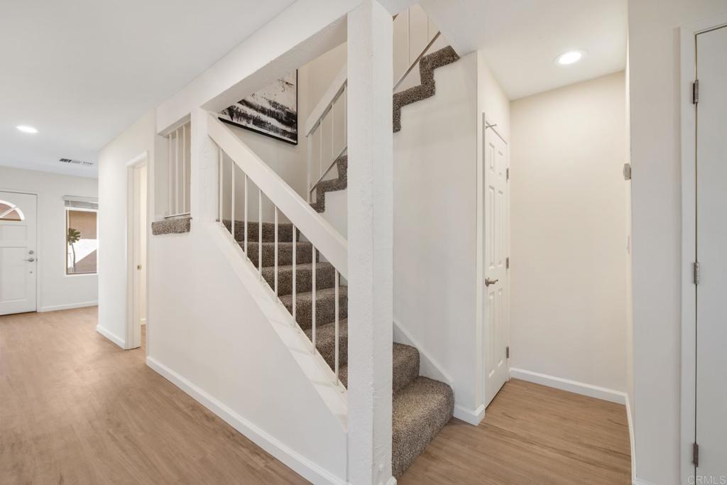 3163 Via De Caballo Encinitas, CA 92024 - Photo 13 of 23 a view of a hallway with wooden floor and entryway