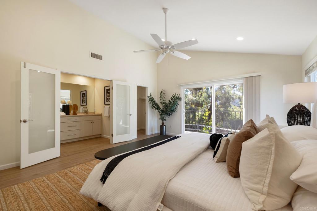 3163 Via De Caballo Encinitas, CA 92024 - Photo 15 of 23 a bedroom with a bed a large window with the outer view