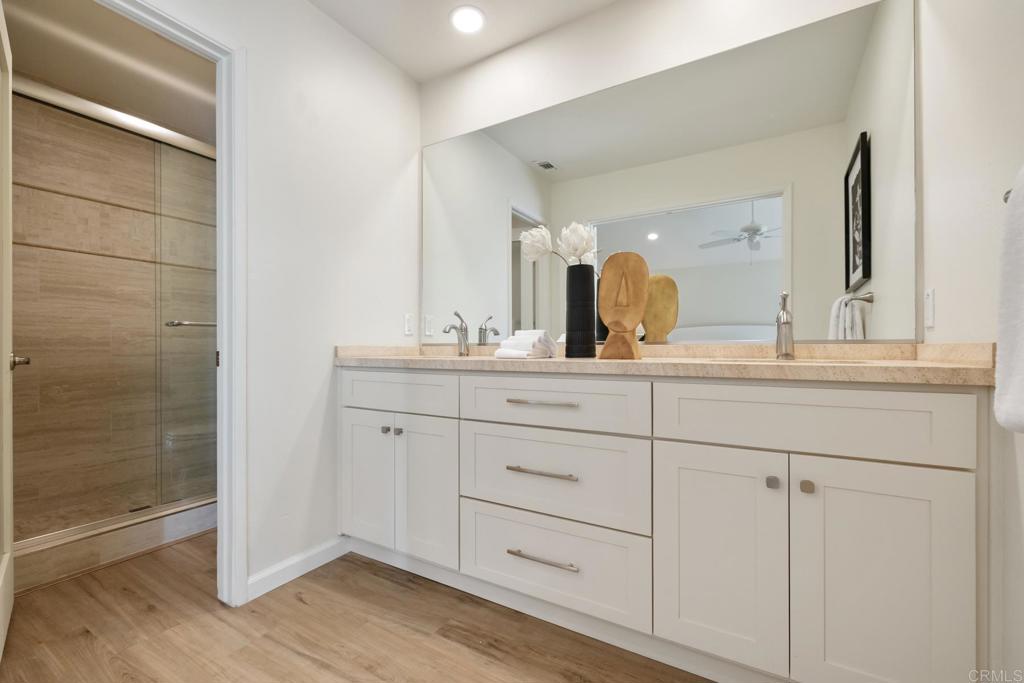 3163 Via De Caballo Encinitas, CA 92024 - Photo 16 of 23 a bathroom with a double vanity sink and mirror