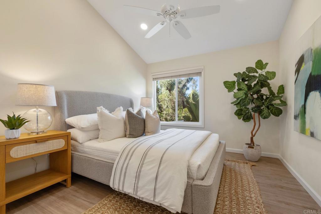 3163 Via De Caballo Encinitas, CA 92024 - Photo 17 of 23 a bedroom with a bed and a potted plant