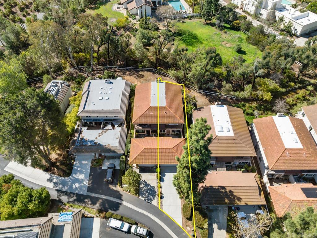 3163 Via De Caballo Encinitas, CA 92024 - Photo 22 of 23 an aerial view of a house with a yard and large trees