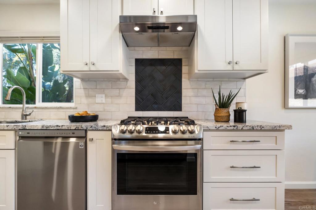3163 Via De Caballo Encinitas, CA 92024 - Photo 4 of 23 a stove top oven sitting inside of a kitchen
