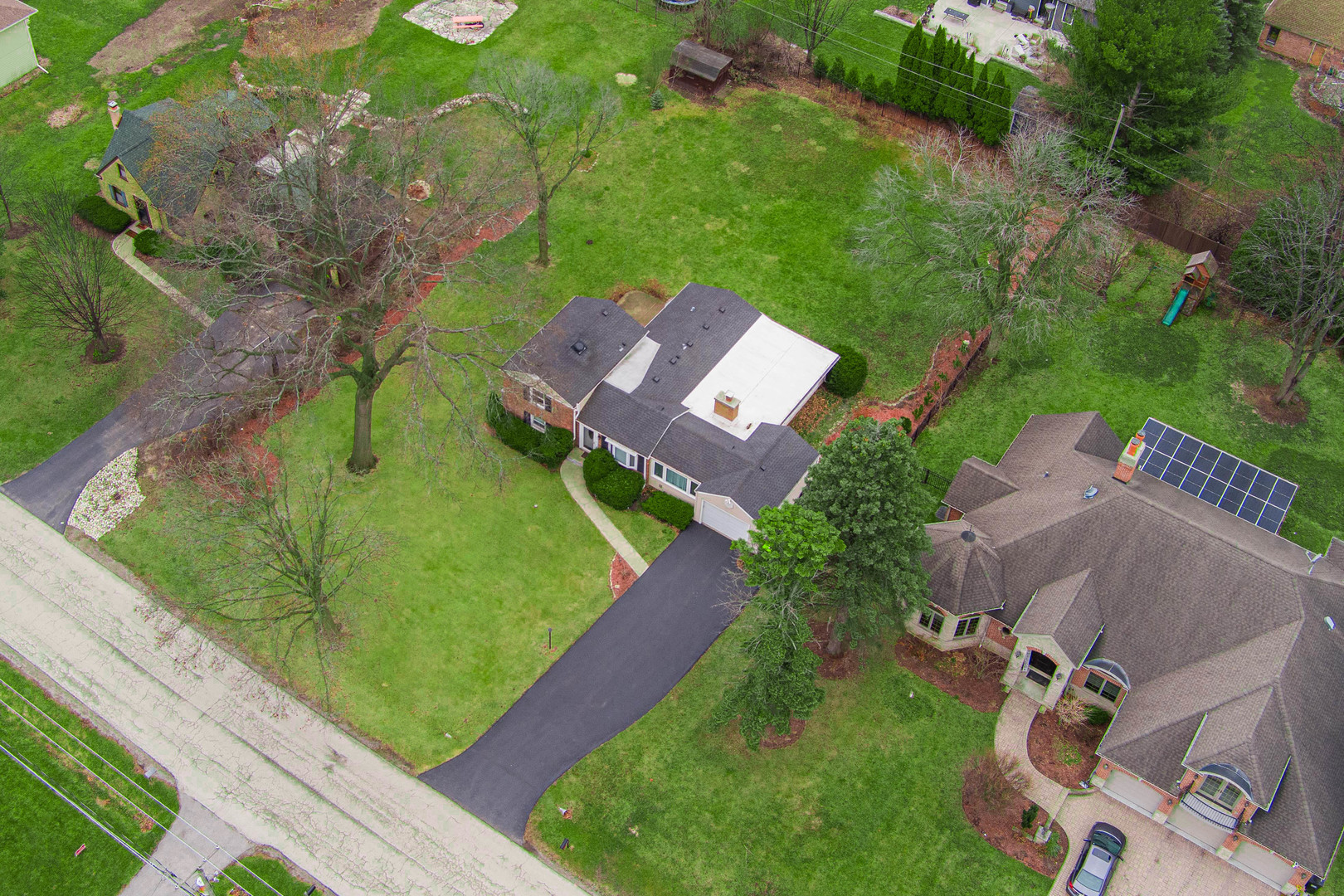 206 Elm Street Prospect Heights, IL 60070 - Photo 2 of 8 an aerial view of a house with garden space and street view