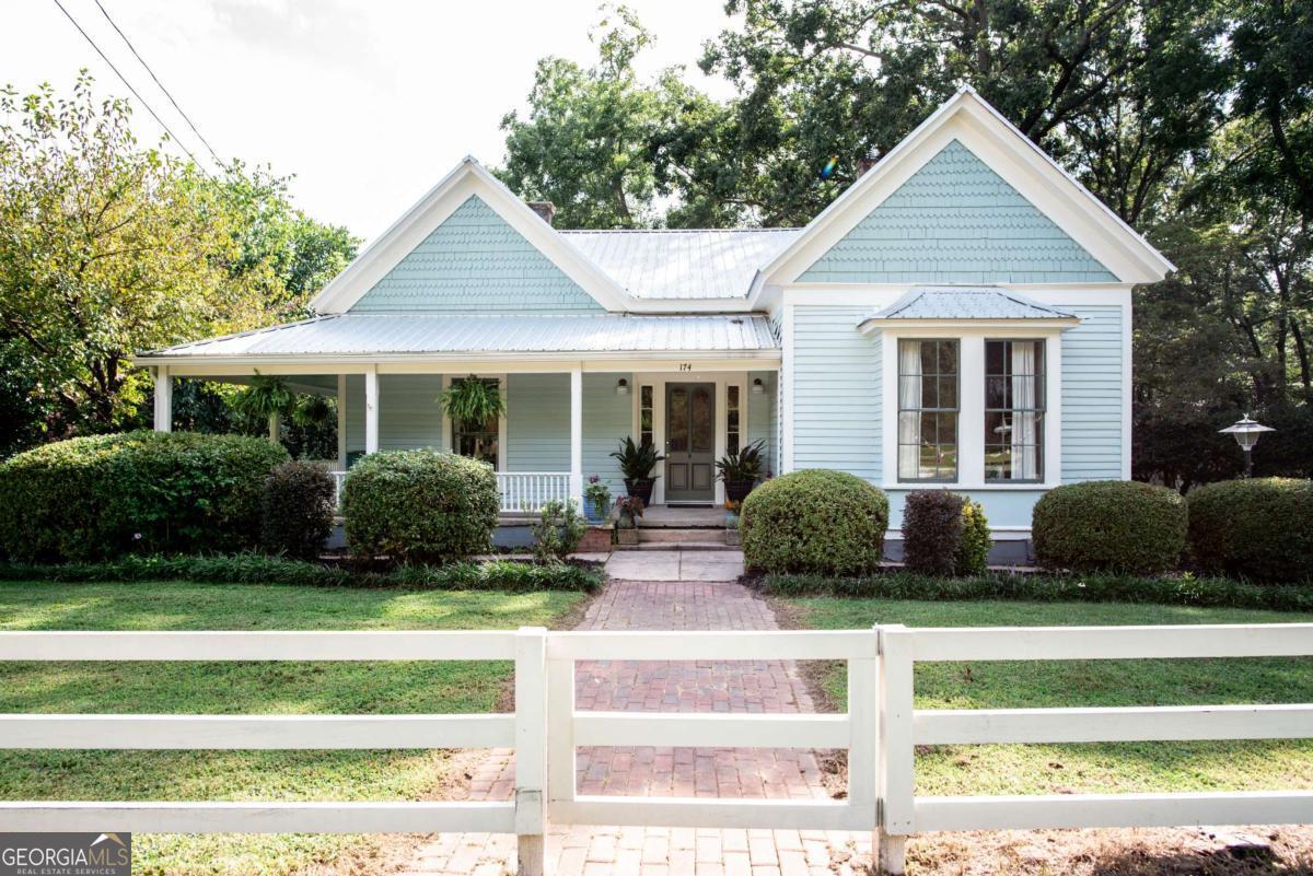 174 North Main Street Winterville, GA 30683 - Photo 1 of 1 a view of a house with a yard and plants